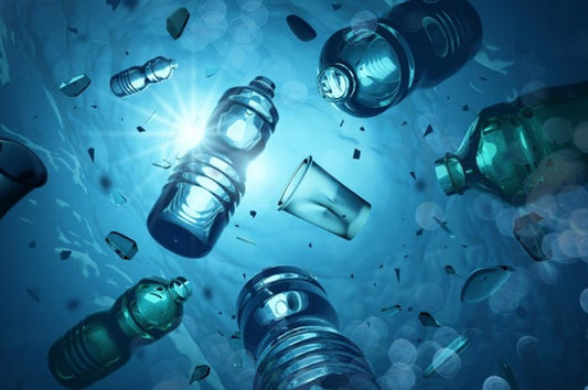 Plastic bottles and cups floating in water