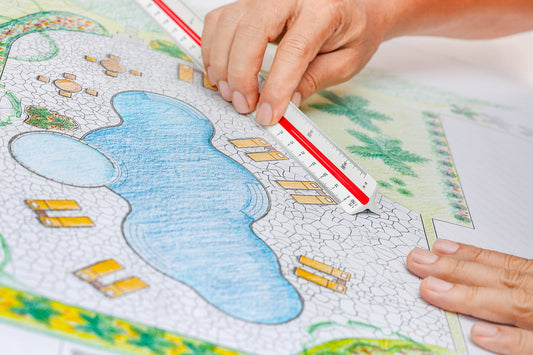 Designing a sustainable pool for a home using a drawing and ruler